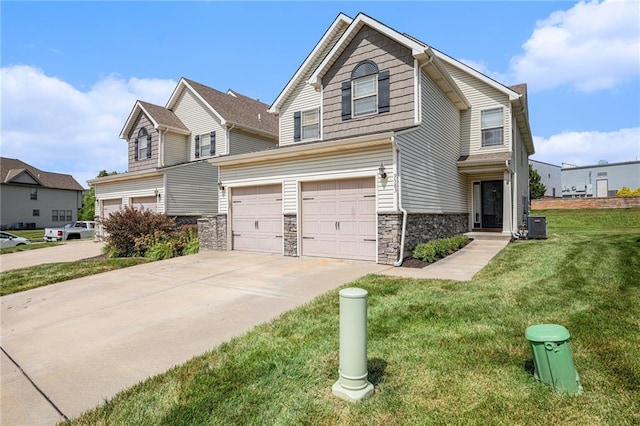 9583 N Main St, Kansas City, MO 64155 - traditional home featuring a garage, driveway, a front yard, and stone siding