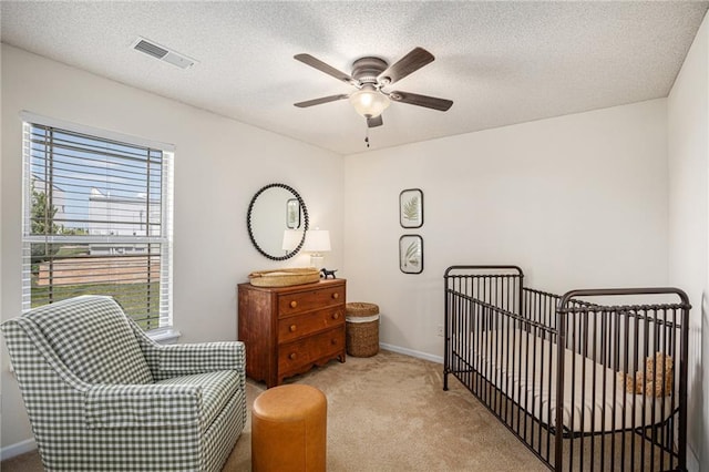 9583 N Main St, Kansas City, MO 64155 - carpeted bedroom with a ceiling fan and a crib