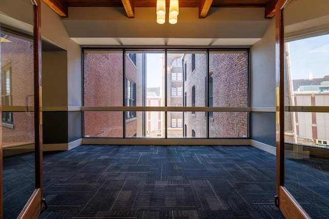 308 W 8th St Unit 409, Kansas City, MO 64105 - unfurnished sunroom with beamed ceiling and a chandelier