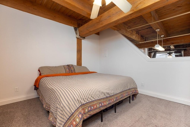308 W 8th St Unit 409, Kansas City, MO 64105 - carpeted bedroom featuring a wooden ceiling with exposed beams