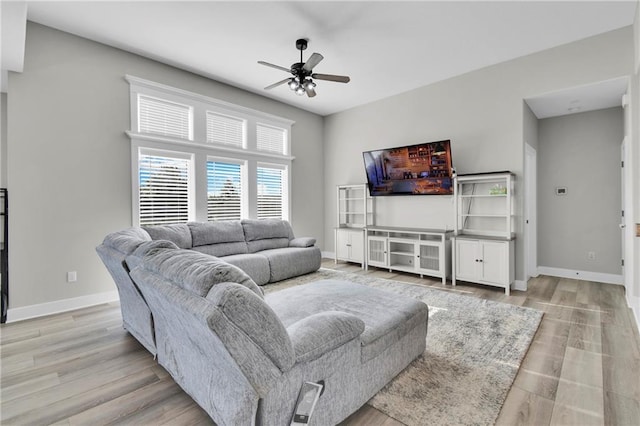 307 S Wilson St, Archie, MO 64725 - living area with a ceiling fan and light wood finished floors