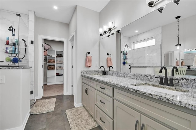 307 S Wilson St, Archie, MO 64725 - full bath featuring a shower stall, double vanity, a walk in closet, and recessed lighting