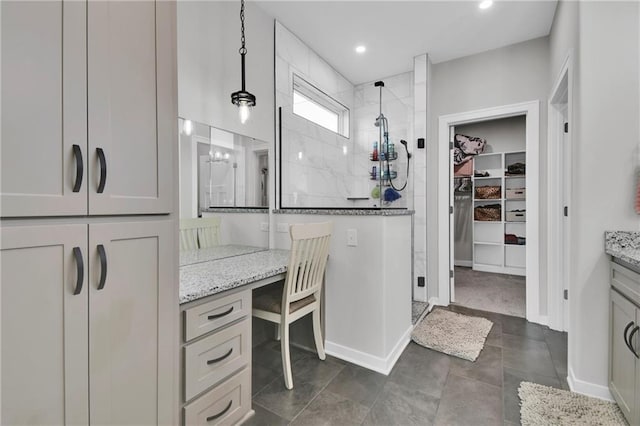 307 S Wilson St, Archie, MO 64725 - full bathroom featuring tiled shower, vanity, a spacious closet, and recessed lighting