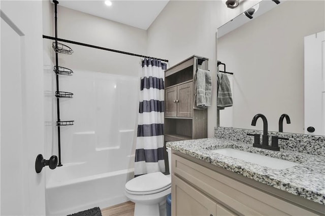307 S Wilson St, Archie, MO 64725 - bathroom featuring vanity, shower / bath combination with curtain, and wood finished floors