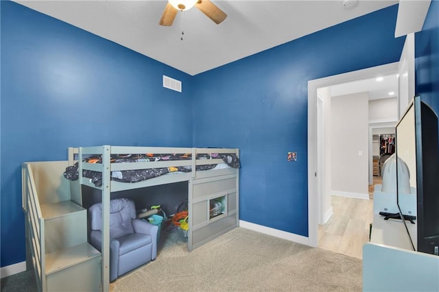 307 S Wilson St, Archie, MO 64725 - carpeted bedroom featuring baseboards and ceiling fan