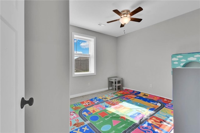 307 S Wilson St, Archie, MO 64725 - recreation room featuring ceiling fan and carpet floors