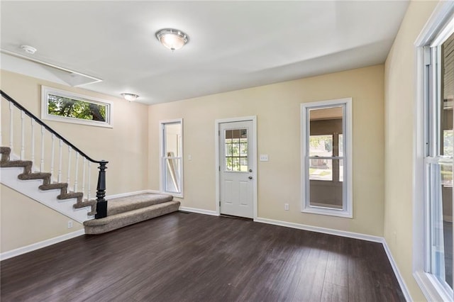 526 S Maple St, Ottawa, KS 66067 - entrance foyer featuring dark wood-type flooring and stairs