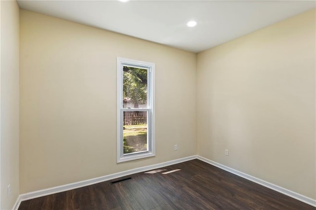 526 S Maple St, Ottawa, KS 66067 - empty room with dark wood-style floors and recessed lighting