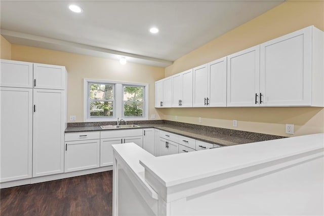 526 S Maple St, Ottawa, KS 66067 - kitchen featuring dark wood-style flooring, white cabinets, a peninsula, recessed lighting, and dark countertops