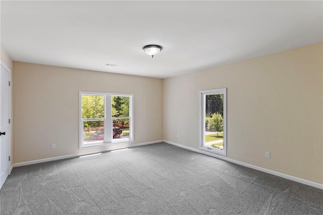 526 S Maple St, Ottawa, KS 66067 - carpeted empty room with baseboards