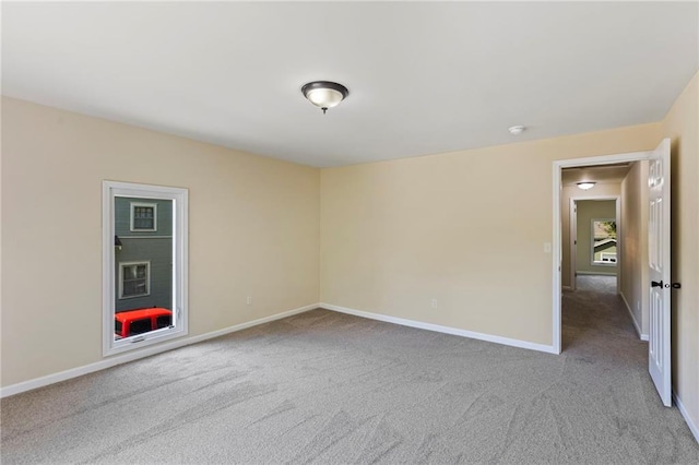 526 S Maple St, Ottawa, KS 66067 - spare room featuring carpet flooring and baseboards