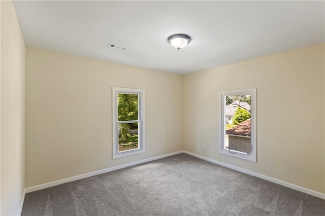 526 S Maple St, Ottawa, KS 66067 - carpeted empty room featuring healthy amount of natural light
