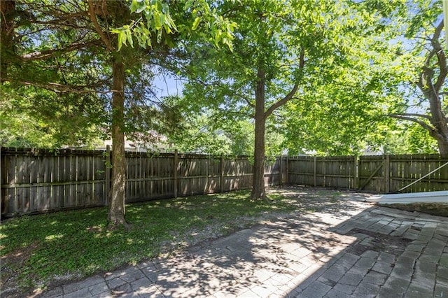 526 S Maple St, Ottawa, KS 66067 - fenced backyard with a patio