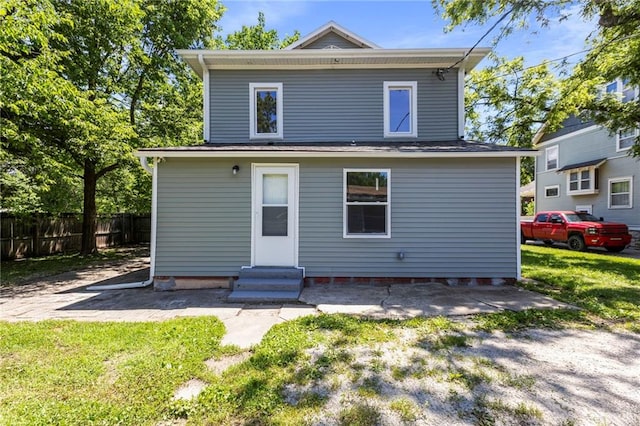 526 S Maple St, Ottawa, KS 66067 - back of property featuring entry steps and a patio area
