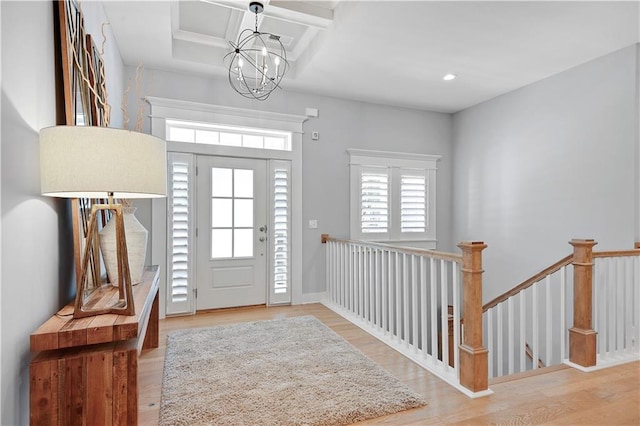 2210 W 73rd St, Prairie Village, KS 66208 - foyer entrance featuring wood finished floors, coffered ceiling, a chandelier, recessed lighting, and beamed ceiling