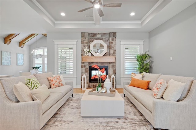 2210 W 73rd St, Prairie Village, KS 66208 - living room with plenty of natural light, beam ceiling, a chandelier, ceiling fan, and a fireplace