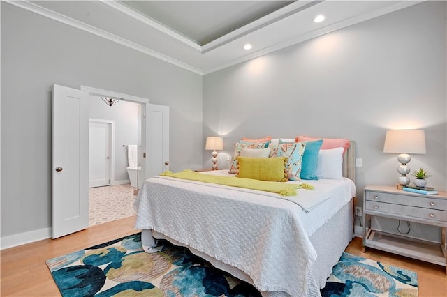 2210 W 73rd St, Prairie Village, KS 66208 - bedroom with wood finished floors, a raised ceiling, crown molding, recessed lighting, and ensuite bath