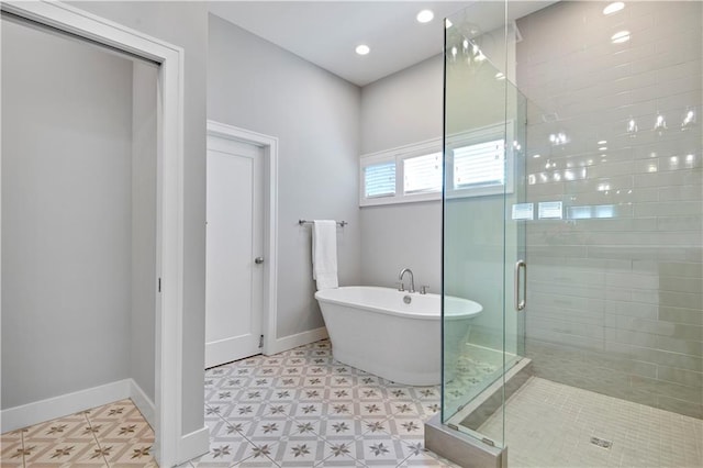 2210 W 73rd St, Prairie Village, KS 66208 - bathroom featuring a freestanding tub, a shower stall, and tile patterned floors