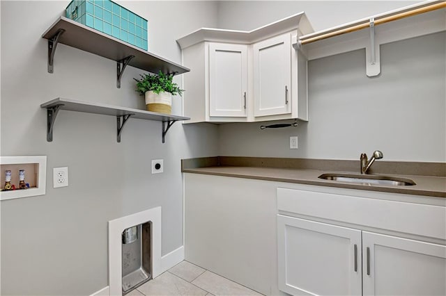 2210 W 73rd St, Prairie Village, KS 66208 - washroom with hookup for an electric dryer, hookup for a washing machine, cabinet space, and light tile patterned flooring