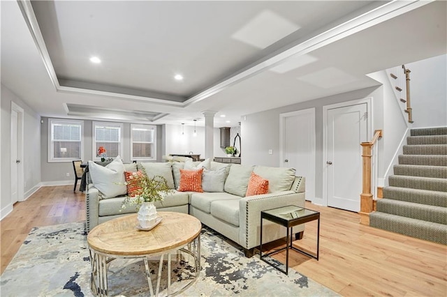2210 W 73rd St, Prairie Village, KS 66208 - living area featuring a raised ceiling, light wood finished floors, stairs, recessed lighting, and ornate columns