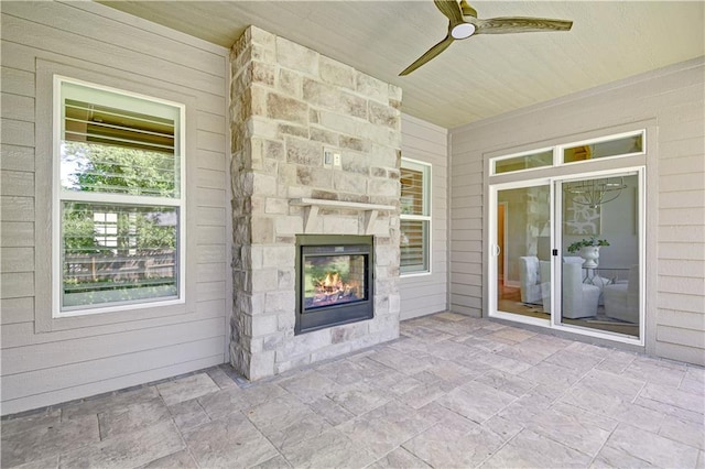 2210 W 73rd St, Prairie Village, KS 66208 - view of patio / terrace featuring an outdoor stone fireplace and a ceiling fan