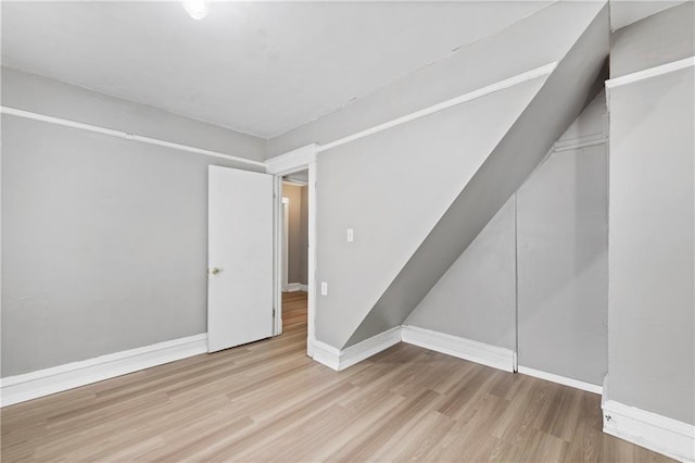 3544 College Ave, Kansas City, MO 64128 - spare room featuring wood finished floors and baseboards