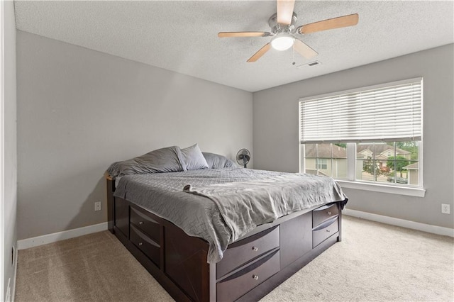 820 Peach Tree Ln, Blue Springs, MO 64064 - bedroom with light carpet, a textured ceiling, and ceiling fan