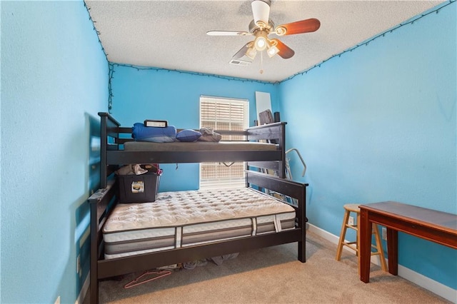 820 Peach Tree Ln, Blue Springs, MO 64064 - bedroom featuring a textured ceiling, carpet floors, and a ceiling fan