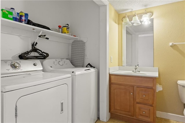 820 Peach Tree Ln, Blue Springs, MO 64064 - laundry room with washing machine and clothes dryer and a textured ceiling