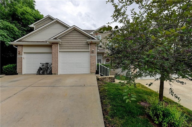 3524 NE Austin Dr, Lees Summit, MO 64064 - view of front of home featuring driveway, brick siding, and an attached garage