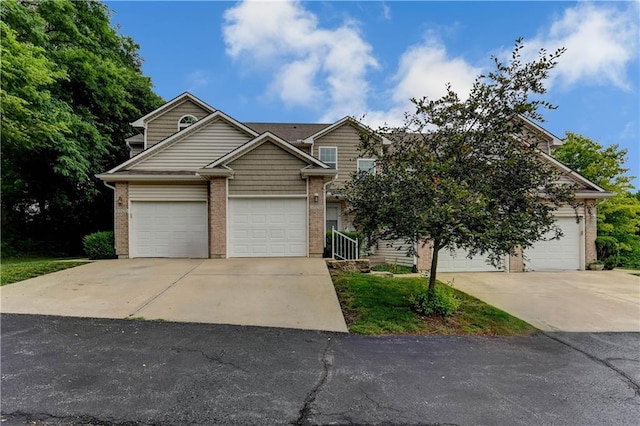 3524 NE Austin Dr, Lees Summit, MO 64064 - view of front of home featuring concrete driveway and brick siding