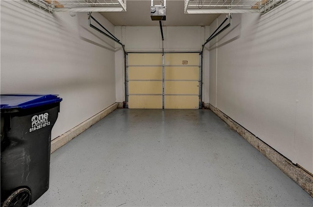 3524 NE Austin Dr, Lees Summit, MO 64064 - garage featuring a garage door opener and baseboards