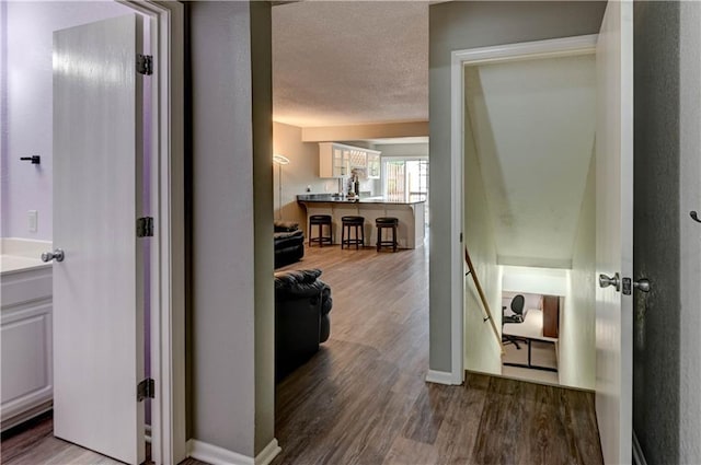 3524 NE Austin Dr, Lees Summit, MO 64064 - corridor featuring wood finished floors and a textured ceiling