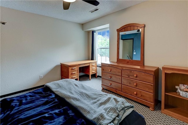 3524 NE Austin Dr, Lees Summit, MO 64064 - carpeted bedroom with a textured ceiling and ceiling fan