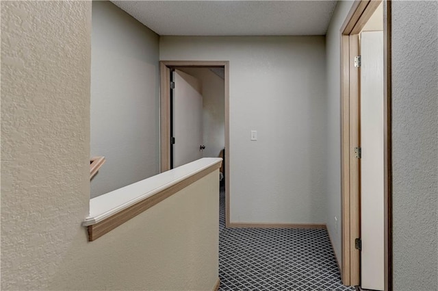 3524 NE Austin Dr, Lees Summit, MO 64064 - hallway featuring a textured wall and a textured ceiling