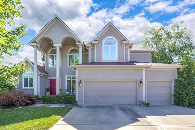 3013 S Granite Ave, Blue Springs, MO 64015 - view of front of property with stucco siding and concrete driveway