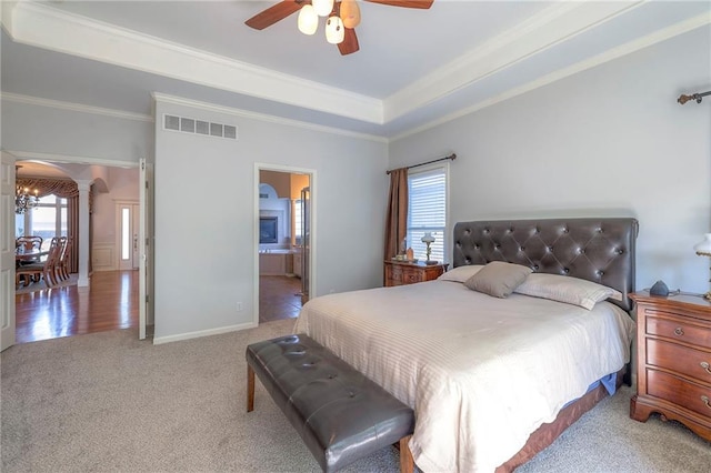3013 S Granite Ave, Blue Springs, MO 64015 - carpeted bedroom with ornamental molding, a raised ceiling, ornate columns, and a ceiling fan