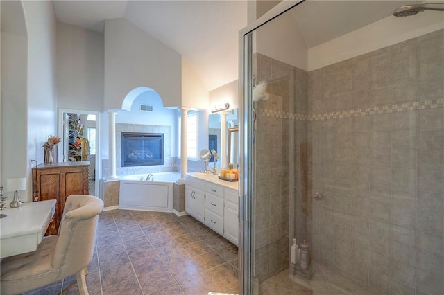 3013 S Granite Ave, Blue Springs, MO 64015 - full bath featuring a stall shower, decorative columns, a bath, vanity, and high vaulted ceiling
