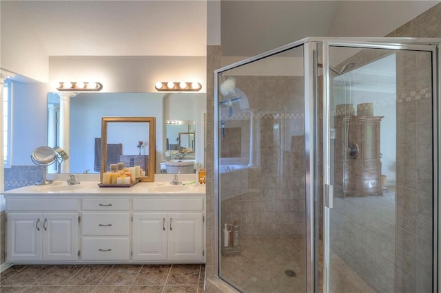 3013 S Granite Ave, Blue Springs, MO 64015 - full bath featuring double vanity, a stall shower, decorative columns, and tile patterned flooring