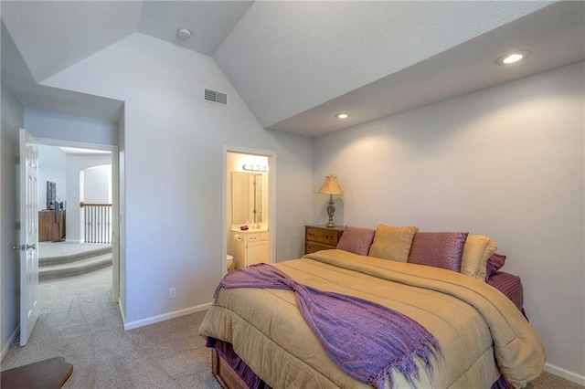 3013 S Granite Ave, Blue Springs, MO 64015 - carpeted bedroom featuring vaulted ceiling, recessed lighting, and ensuite bath