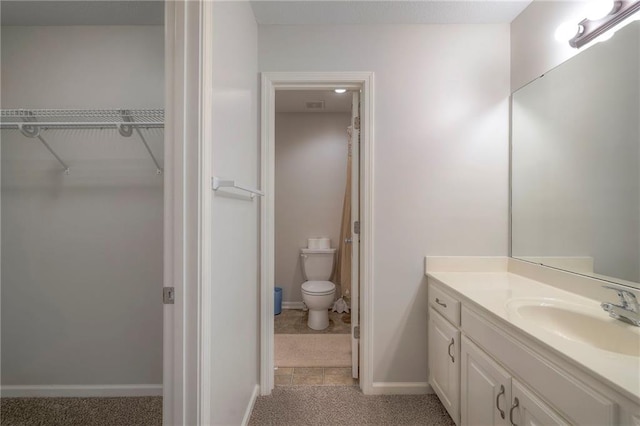 3013 S Granite Ave, Blue Springs, MO 64015 - full bathroom featuring vanity and a walk in closet