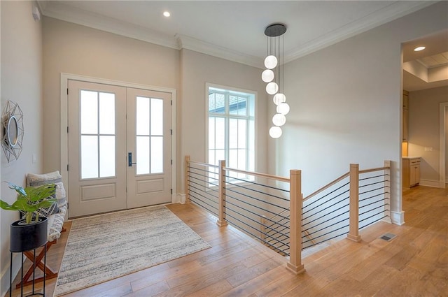 7736 N Donnelly Ave, Kansas City, MO 64158 - entryway featuring light wood-type flooring, french doors, crown molding, and recessed lighting