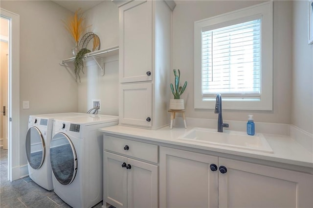 7736 N Donnelly Ave, Kansas City, MO 64158 - laundry area featuring separate washer and dryer and cabinet space