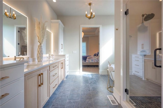 7736 N Donnelly Ave, Kansas City, MO 64158 - ensuite bathroom featuring double vanity, a chandelier, walk in shower, and recessed lighting