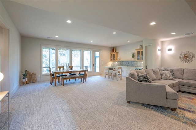 7736 N Donnelly Ave, Kansas City, MO 64158 - living room with light carpet and recessed lighting