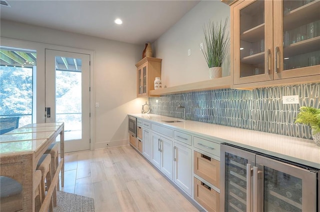 7736 N Donnelly Ave, Kansas City, MO 64158 - bar with wine cooler, recessed lighting, backsplash, and stainless steel microwave