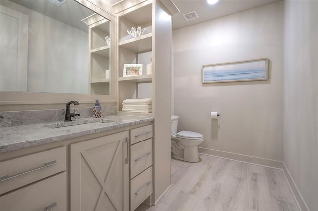 7736 N Donnelly Ave, Kansas City, MO 64158 - bathroom with vanity and wood finished floors