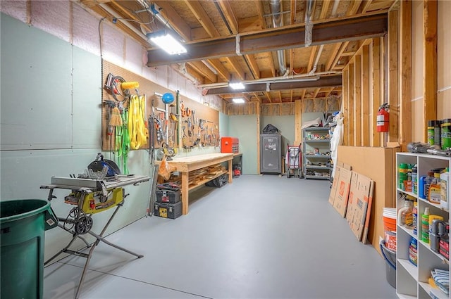 7736 N Donnelly Ave, Kansas City, MO 64158 - unfinished basement with a workshop area