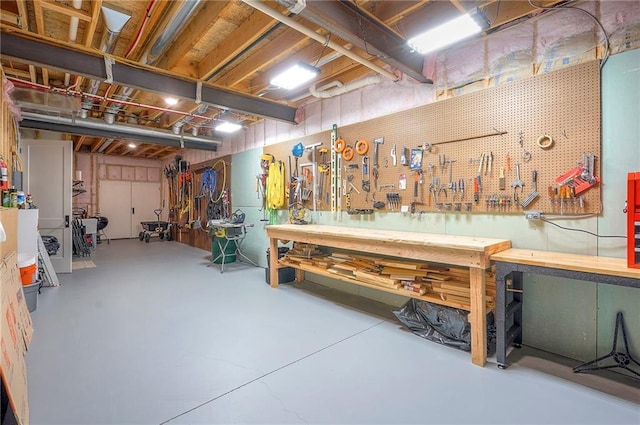 7736 N Donnelly Ave, Kansas City, MO 64158 - unfinished below grade area featuring a workshop area