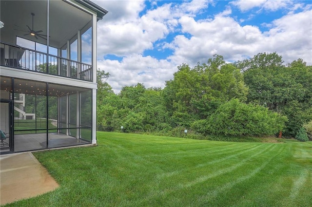 7736 N Donnelly Ave, Kansas City, MO 64158 - view of green lawn with a sunroom and a ceiling fan